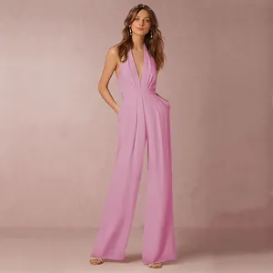Elegant pink sleeveless halter neck jumpsuit featuring a deep V-neck and wide leg silhouette
