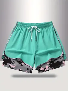 Women's 2-in-1 mint green sports shorts featuring a pixelated camouflage inner lining