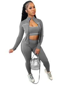 Set sportivo grigio da 3 pezzi con giacca zip, canotta e leggings a vita alta
