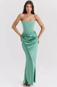 Elegant sage green strapless corset evening gown featuring a draped satin maxi skirt.