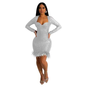 Detailed view of a silver sequin bodycon dress with elegant feather trim hemline