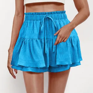 Detail shot of bright blue tiered ruffle skort featuring a textured fabric and drawstring