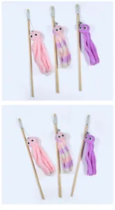 Detailed view of three colorful plush octopus cat teaser wands with wooden sticks.