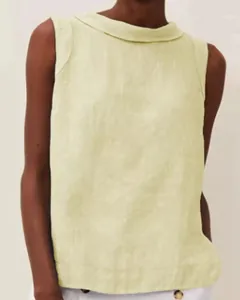 Close-up detail of a minimalist light yellow cotton linen sleeveless top for women