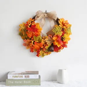 Autumn maple leaf wreath with large burlap bow for indoor wall and door decoration