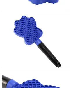 Close-up detail of blue silicone bristles on a pet bath brush for grooming and massage.