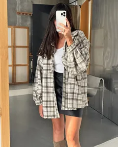 Oversized retro plaid shirt for women styled in a street fashion casual mirror selfie