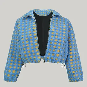 Detailed texture of blue and yellow checkered lamb wool cropped jacket with zipper