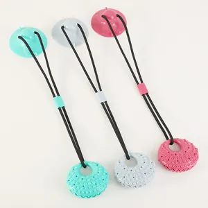 Durable dog chew toy with suction cup and textured treat dispensing ring in three colors