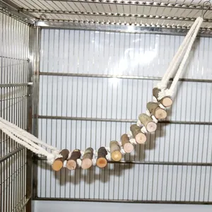 Natural wood parrot bridge hanging ladder toy installed inside a stainless steel cage