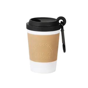 Distributeur de sacs à déjections canines en forme de tasse à café avec mousqueton.