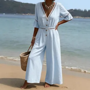 Light blue V-neck wide-leg jumpsuit with delicate lace hollow-out details for beach holiday