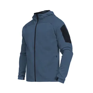Close-up detail of a blue hooded sports jacket featuring a black sleeve utility pocket