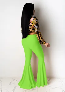 Sexy women's neon green flared bell-bottom pants with baroque floral print crop top