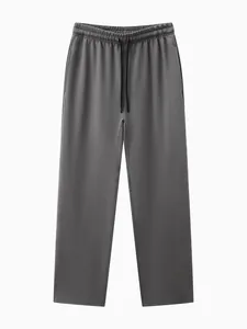 Vue frontale du pantalon de sport gris ample pour homme avec taille élastique à cordon