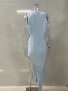 Detailed back view of a light blue ribbed knit midi dress with sexy side slit design