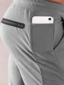 Men's athletic joggers featuring a side phone pocket and secure zipper compartment