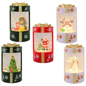 Christmas light-up snow globes in gift box shapes with festive holiday figures inside