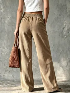 Back view of vintage high-waisted corduroy wide-leg pants in tan for a casual autumn look