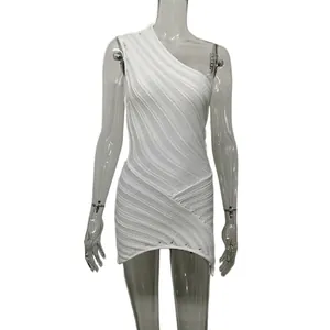 Detail view of white one-shoulder knitted mini dress with textured hollow-out design