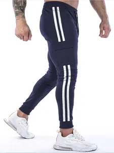 Side view of navy blue fitness joggers with white stripes and cargo pocket detail