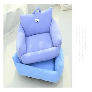 Macro view of blue corduroy sofa-style pet bed with cute decorative eye detail