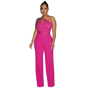 Elegant hot pink one-shoulder jumpsuit featuring golden studs and chic wide-leg design