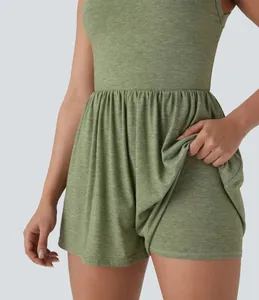 Detail view showing built-in safety shorts of green sleeveless athletic mini dress