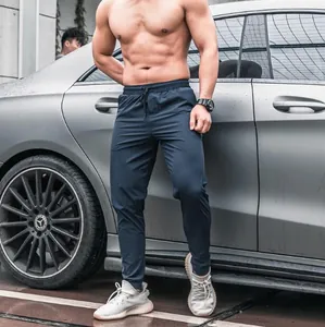 Men's quick-dry athletic training pants in navy blue slim fit design for gym workout