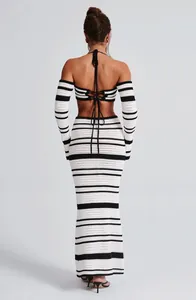 Back view detail of women's striped crochet halter top and long maxi skirt two-piece set.