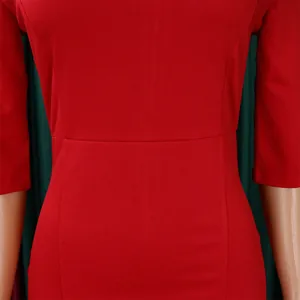 Close-up of the elegant red bodycon dress waistline showing refined fabric texture