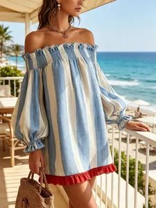 Detail of off-shoulder striped vacation dress with red ruffle hem and bubble sleeves