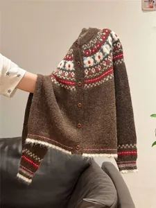 Close-up of vintage Fair Isle pattern on brown knitted cardigan for autumn