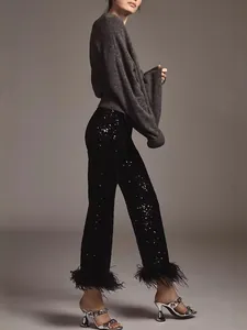 Elegant black sequined flared pants with ostrich feather hem and low-waist slim fit for parties