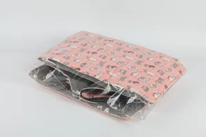 Detail view of a folded waterproof cat house inside clear plastic packaging bag.
