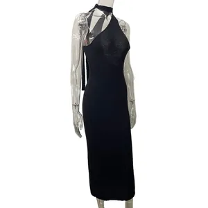 Side view detail of a sexy black one-shoulder bodycon midi dress for beach vacation