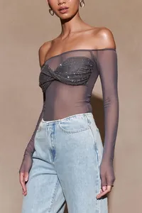 Close-up of grey sheer off-the-shoulder long sleeve top with sequined twist front detail