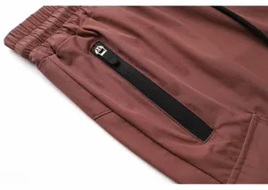 Close-up detail of a black zippered pocket on men's quick-drying cargo shorts