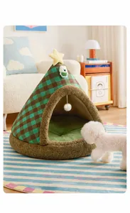 Close-up detail of the wide entrance on this Christmas tree-shaped enclosed pet bed