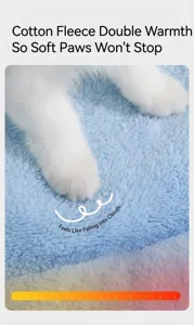 Macro view of soft blue fleece pet bed material with cute white cat paws touching it
