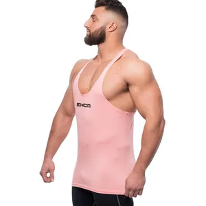 Side view of a slim fit pink men's fitness stringer vest in breathable sport fabric