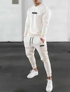 Men's off-white muscle fit tracksuit set featuring long sleeve sweatshirt and joggers