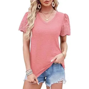 Close-up view of a pink V-neck casual T-shirt featuring intricate lace eyelet sleeve details