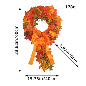 Autumn harvest maple leaf wreath with bright orange bow for front door and wall decor