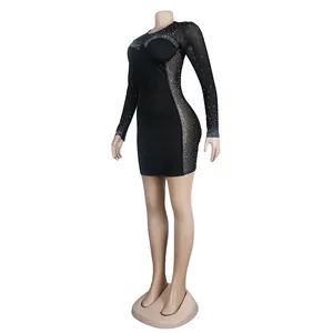 Side view of black rhinestone bodycon dress with sheer mesh panels shown on a mannequin