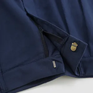 Detail of navy cotton linen shorts showing high-quality zipper and metal hook closure