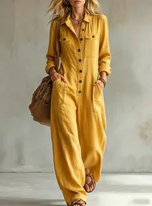 Detailed view of loose yellow linen jumpsuit with lapels and wide-leg cargo pant style