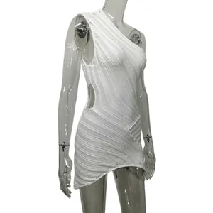 Detailed view of white one-shoulder knitted dress featuring waist cutout and stripes