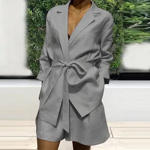 Detailed view of a grey casual two-piece suit set with a tie-waist blazer and matching shorts.