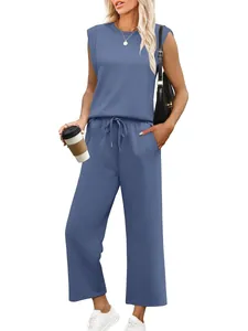 Full body shot showing the fit and drape of the sleeveless top and wide-leg pants set
